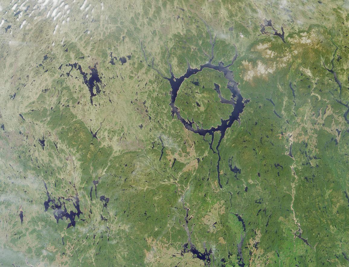 the reservoir fills a circular crater, with an island in the middle